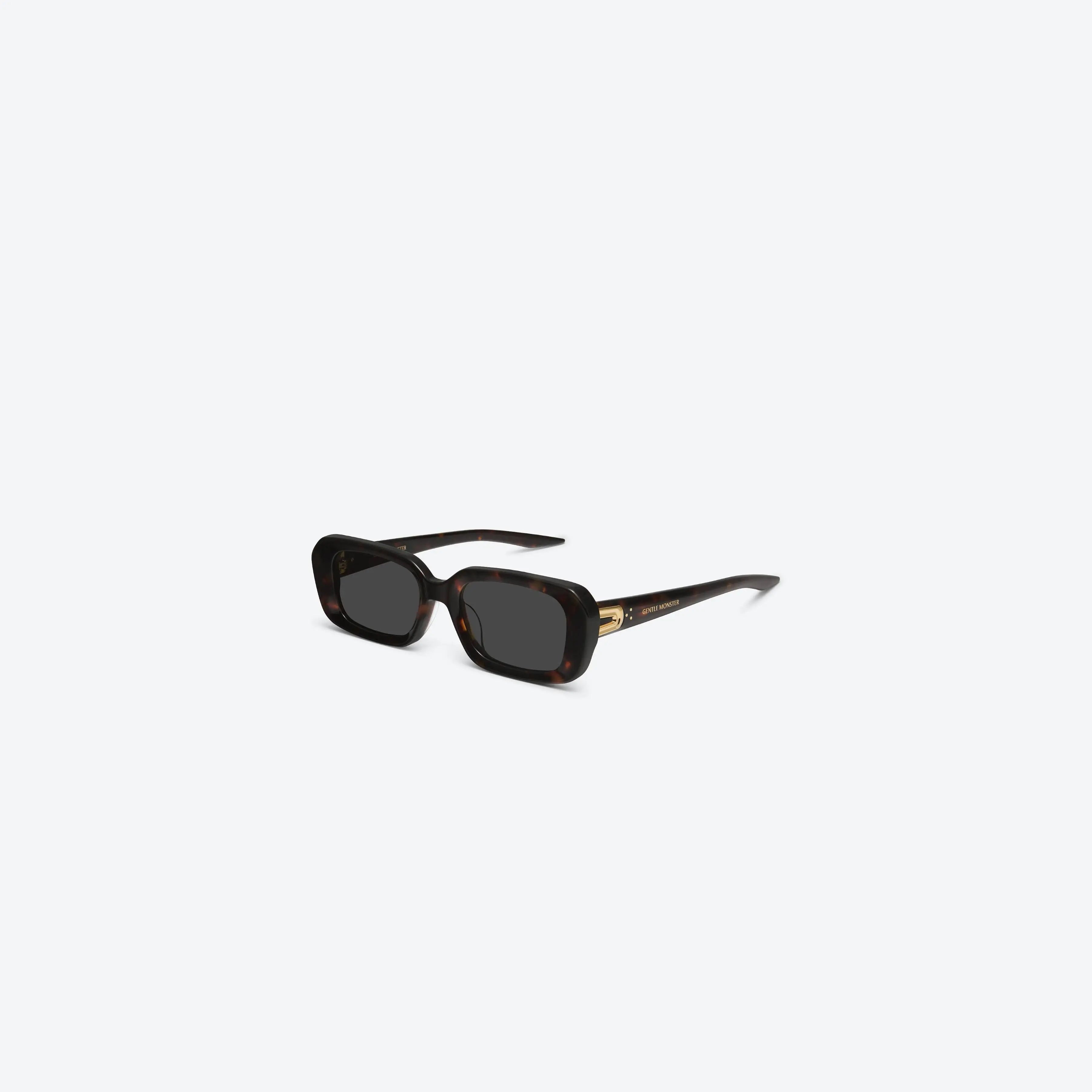 Lunettes de soleil femme Gentle Monster Melrose T1, monture écaille et verres noirs.